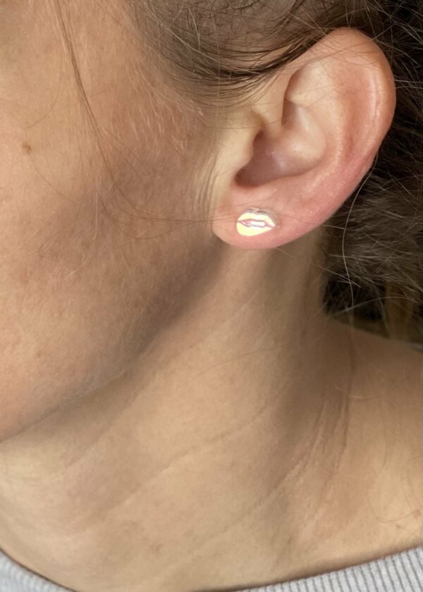 Acrylic iridescent lips stud earrings in ear