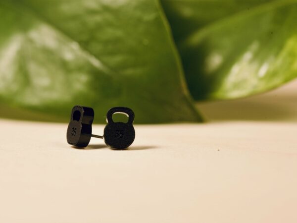 Acrylic 35 lb kettlebell stud earrings in matte black.