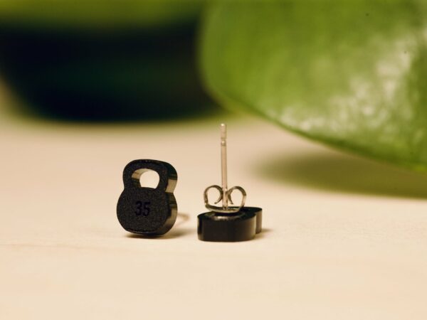 Acrylic 35 lb kettlebell stud earrings in matte black.